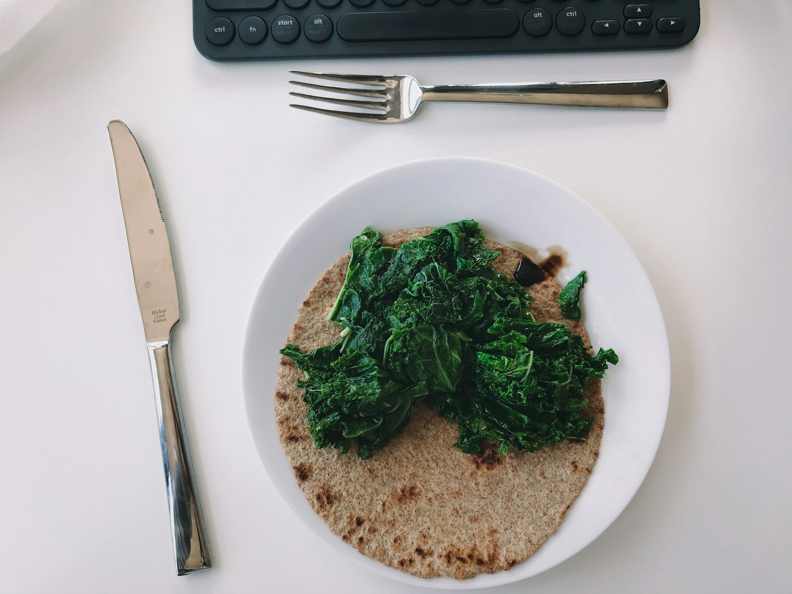Spinach piled on a whole wheat tortilla for a quesadilla