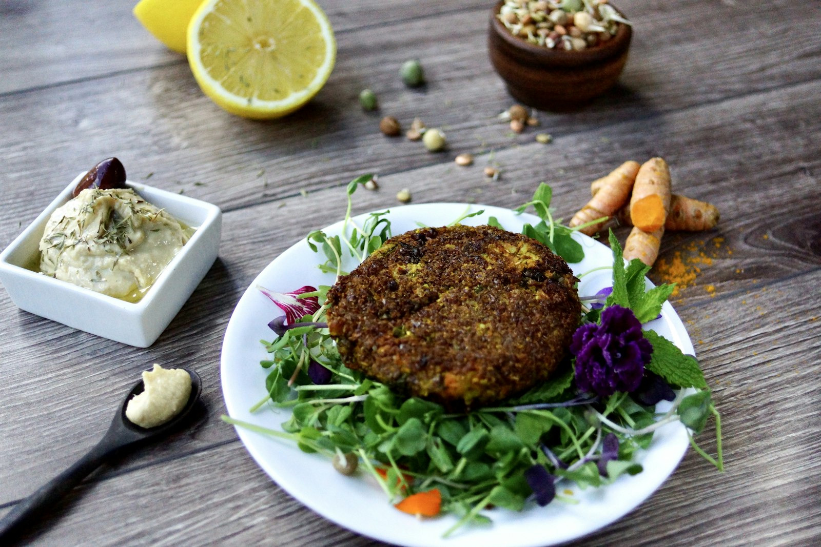 Veggie burger patty with salad and dip