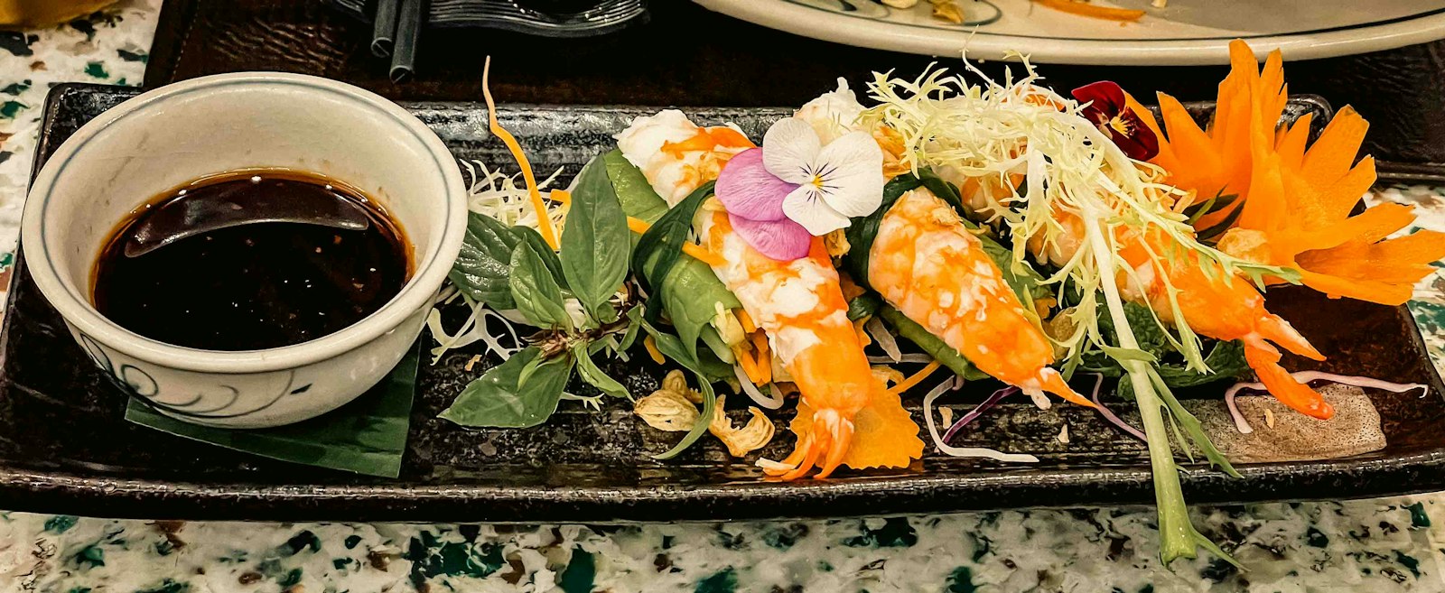 Mango and shrimp wrapped in rice paper with dipping sauce