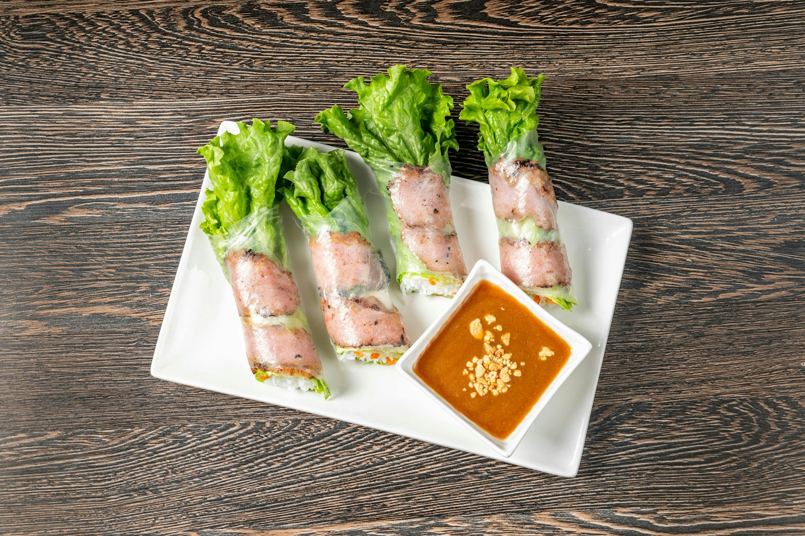 Fresh spring rolls with lettuce and peanut dipping sauce
