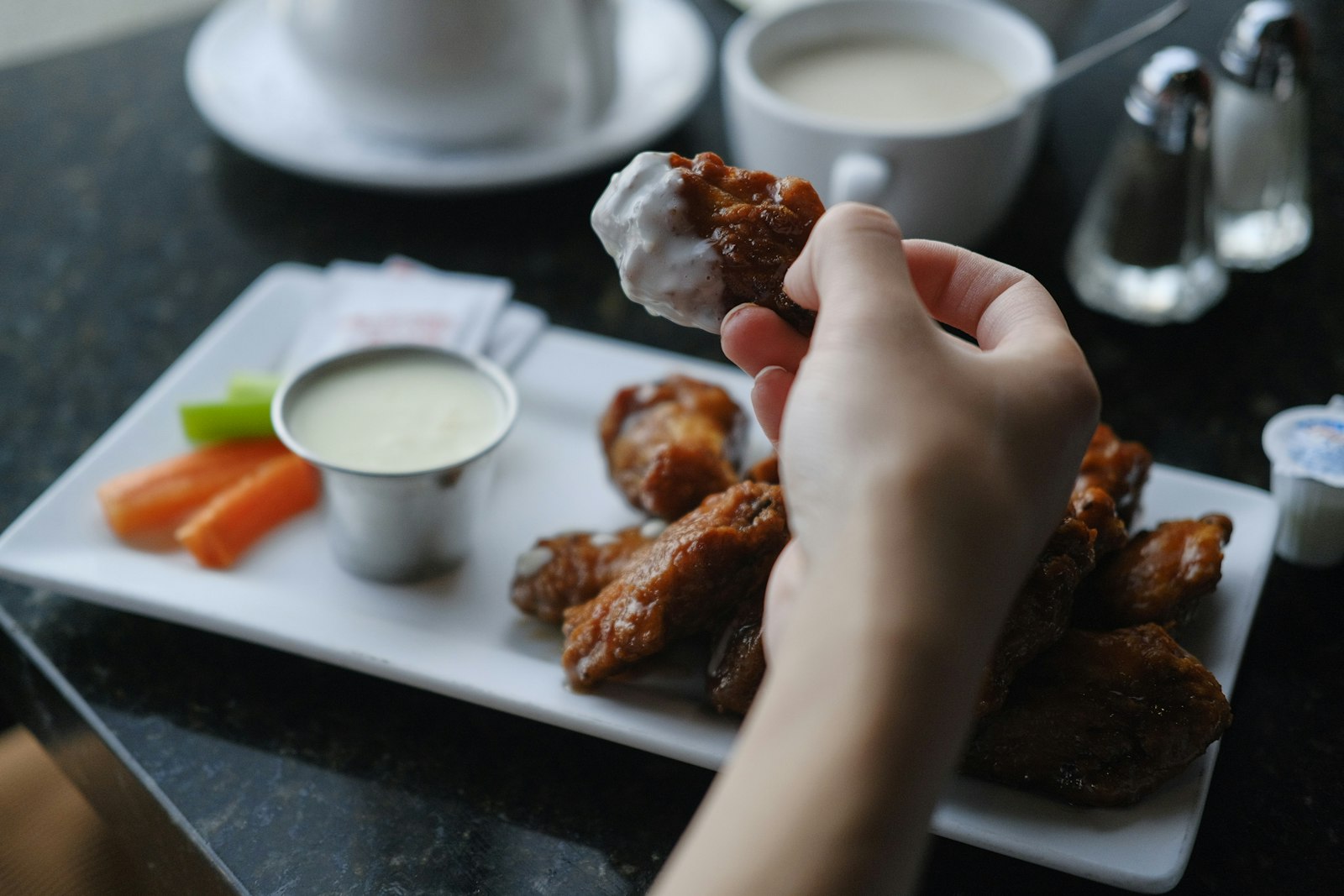 Chicken wing dipped in creamy ranch