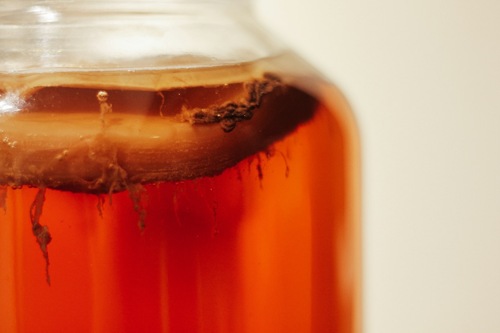 Homemade kombucha in a glass jar