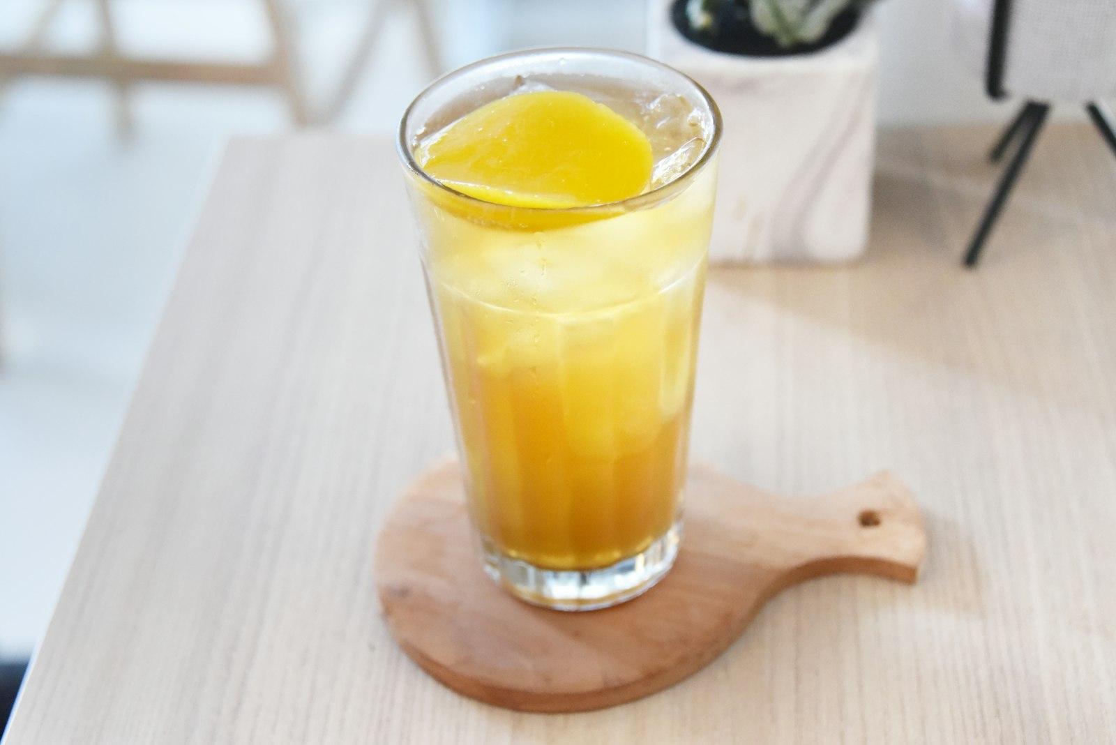 Golden pineapple soda in a tall glass