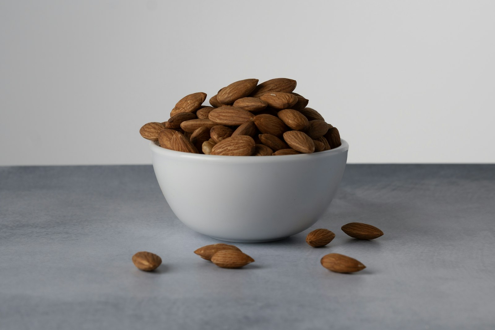 White bowl of almonds