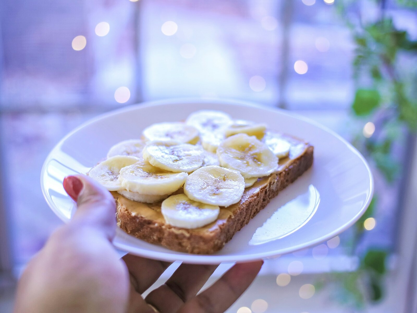 Peanut butter toast topped with banana slices