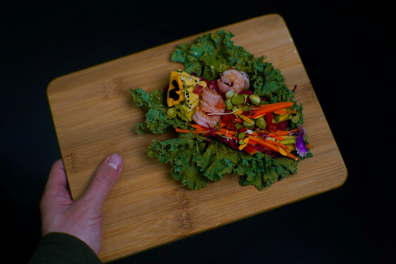Rainbow veggie wraps on a wooden board