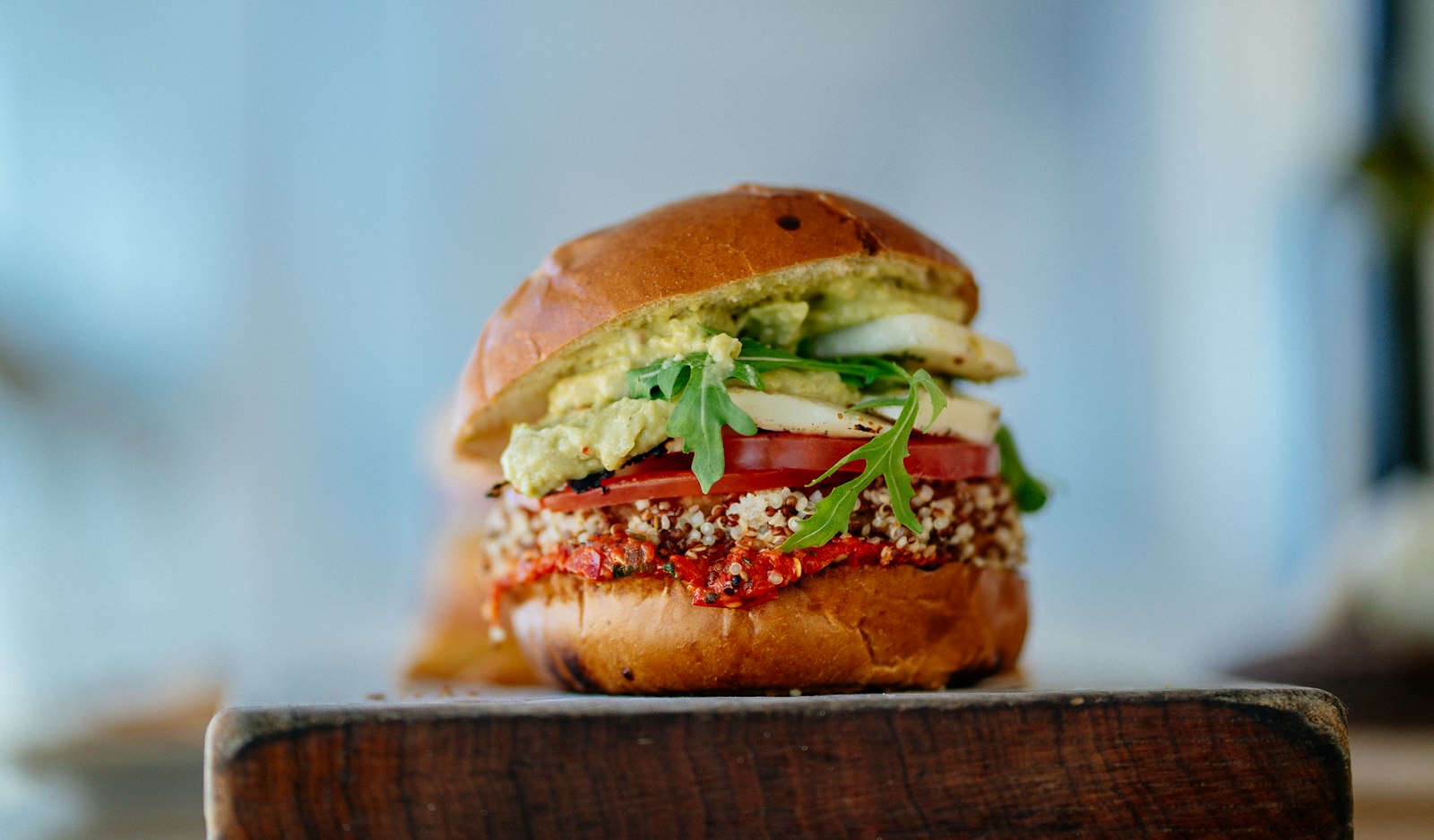 Veggie burger with greens on a toasted bun