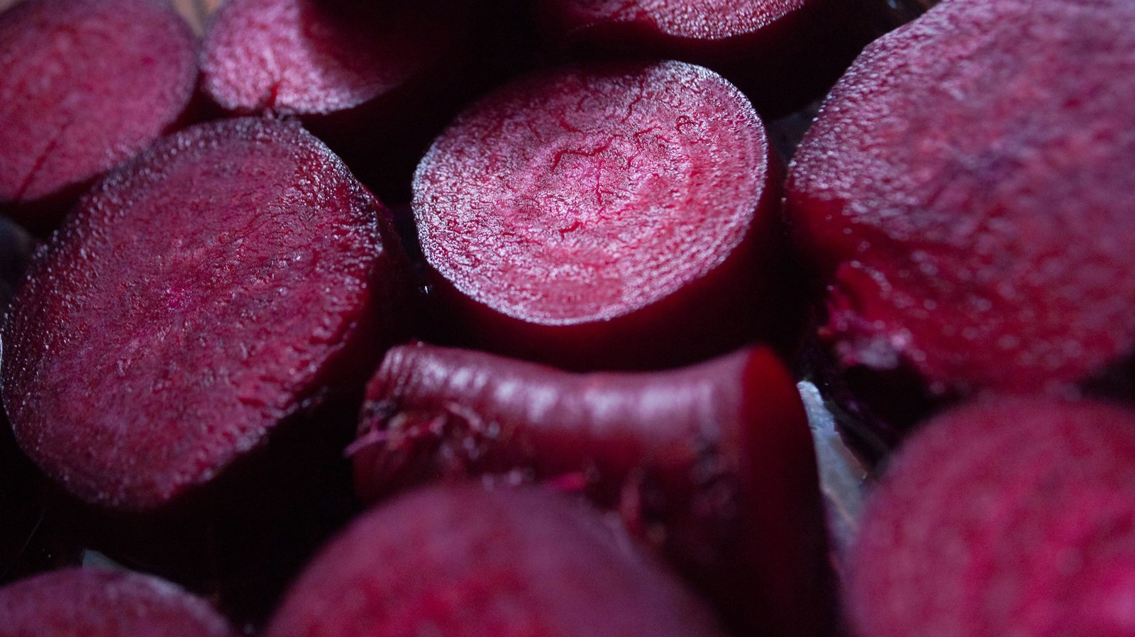 Halved deep red root vegetables ready for pickling