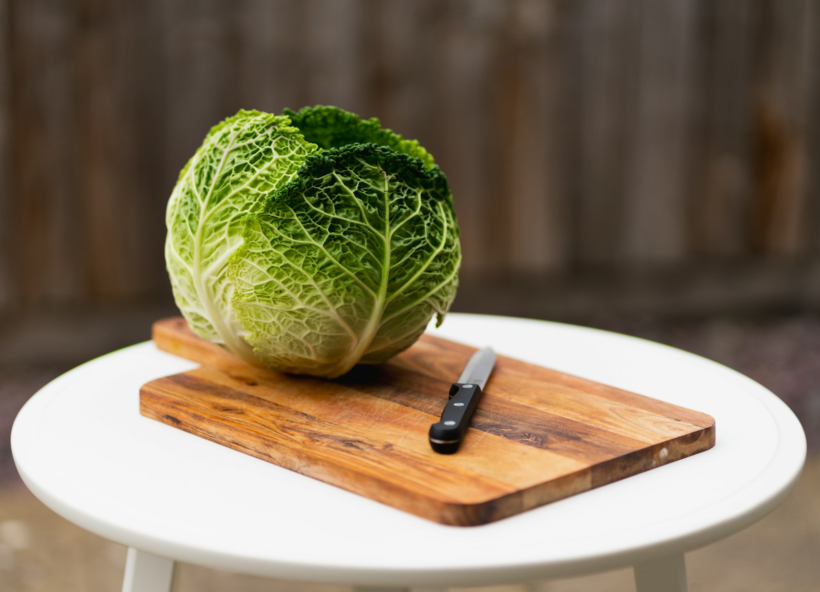 Whole cabbage on a cutting board