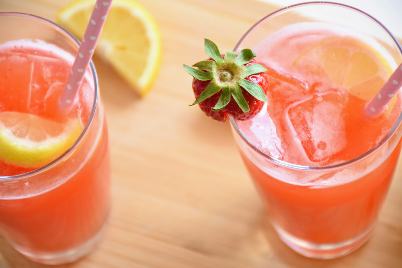 Glasses of strawberry lemonade with fresh berries