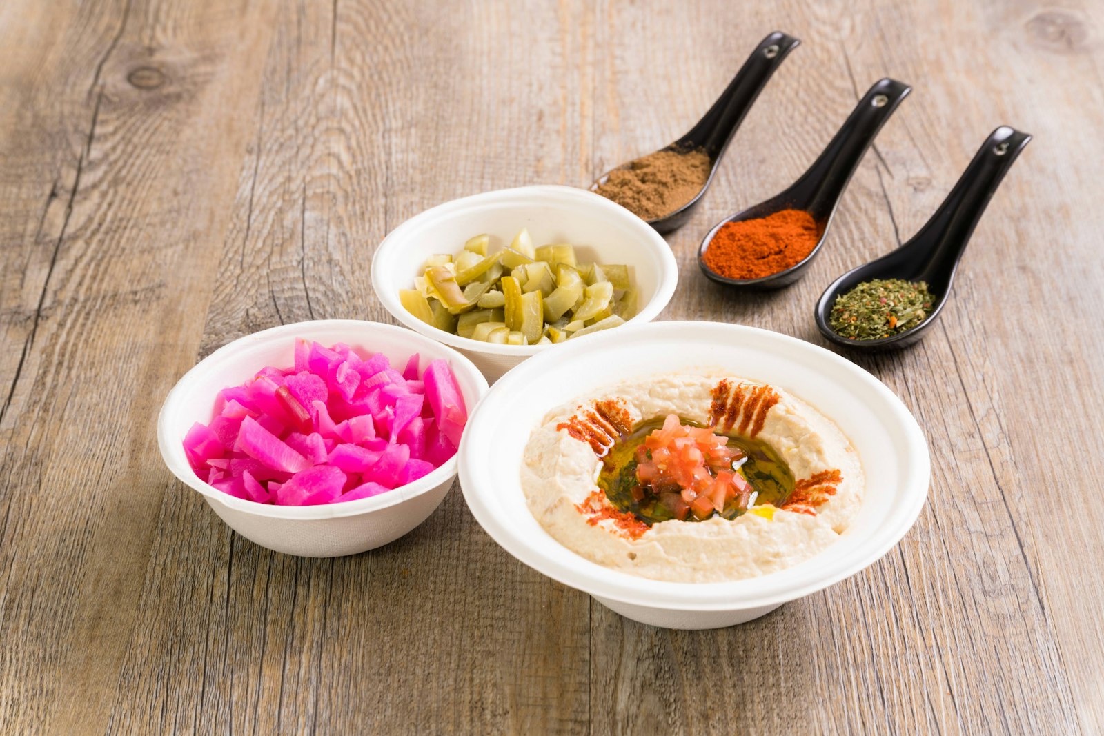 Bowls of hummus with spices