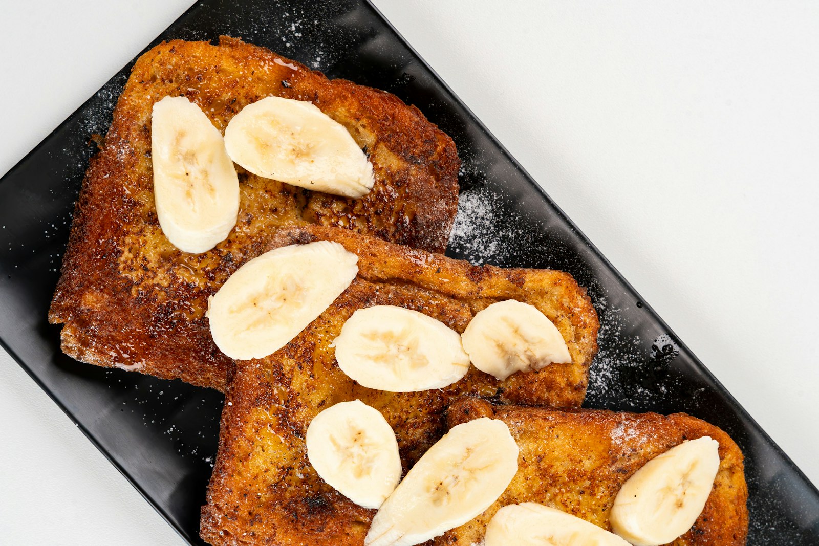 Caramelized banana slices on golden brioche
