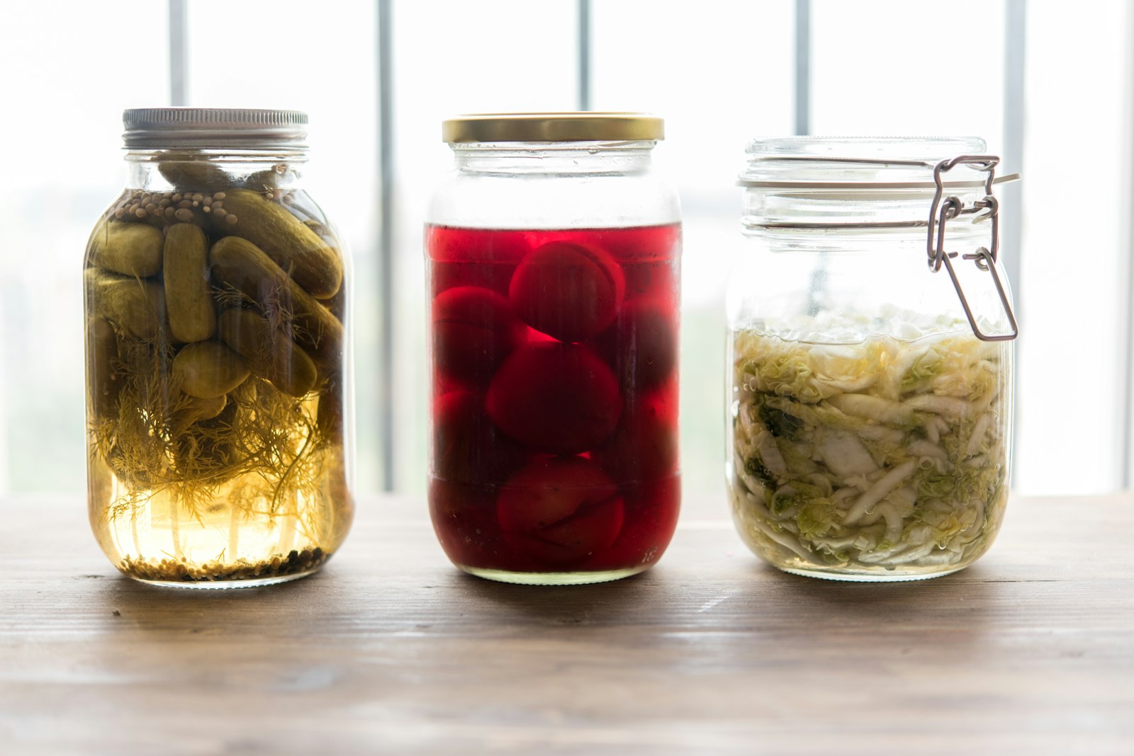 Jars of beets, cucumbers and cabbage in brine