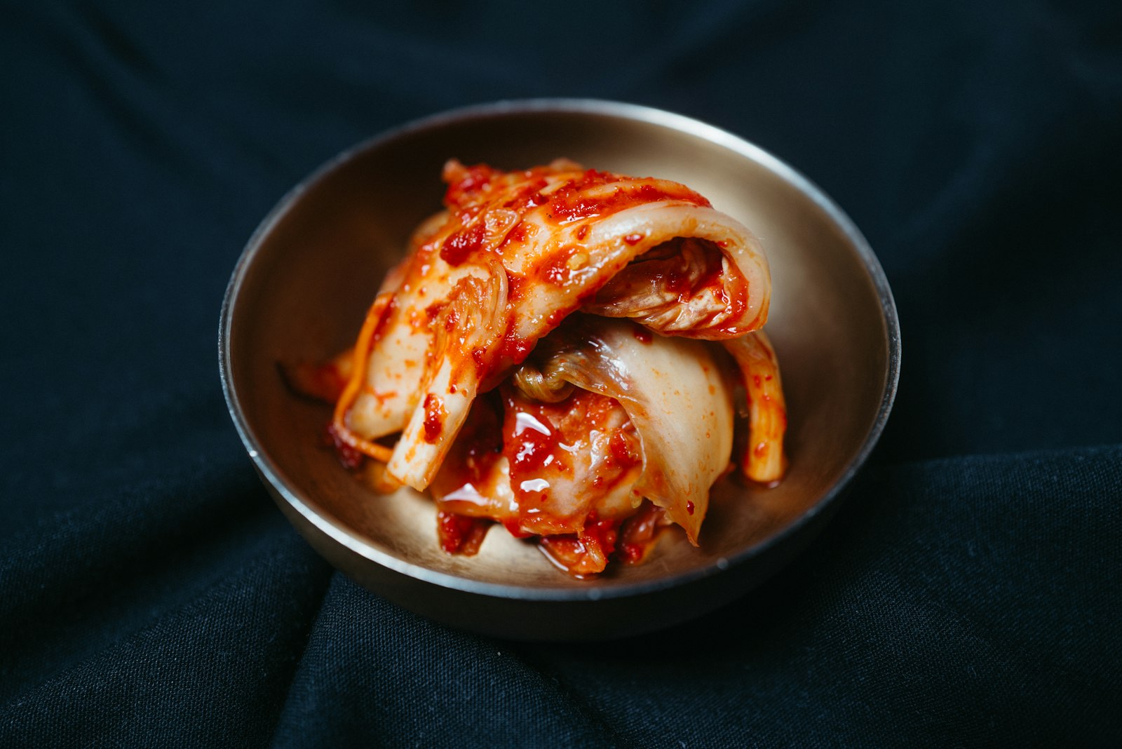 Fresh kimchi in a metal bowl