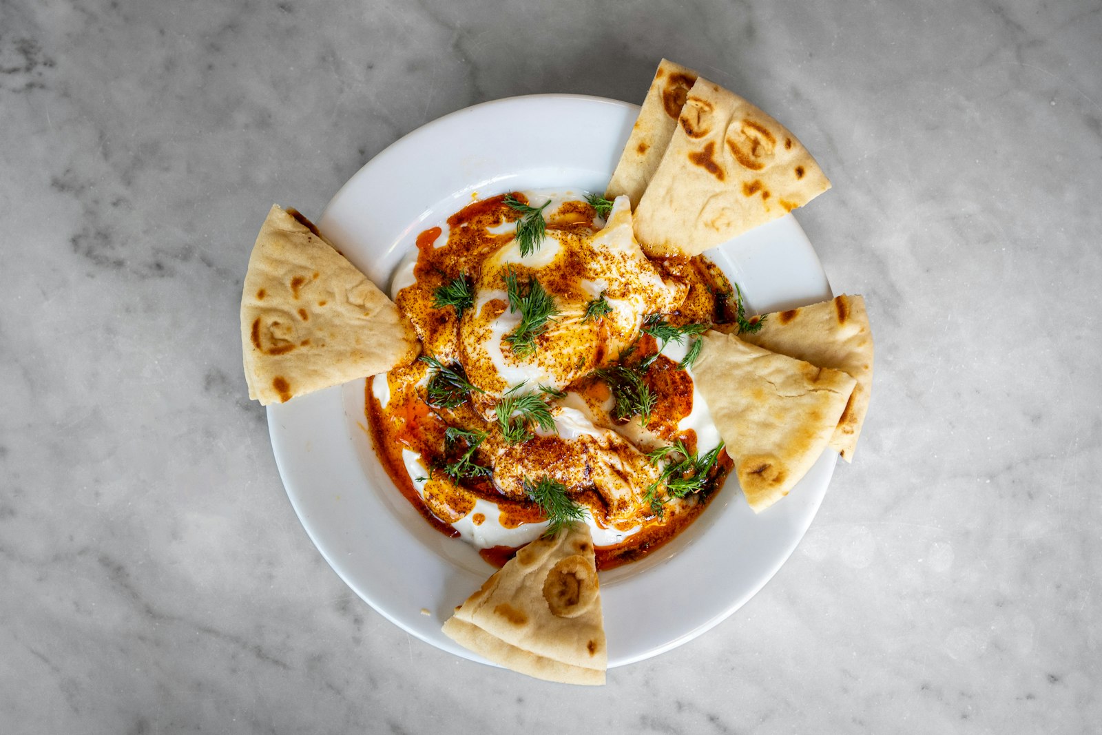 Labneh mezze with chili oil and warm pita