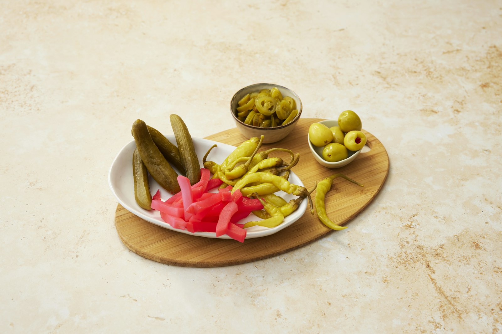 Pink turnip quick pickles with peppers and olives