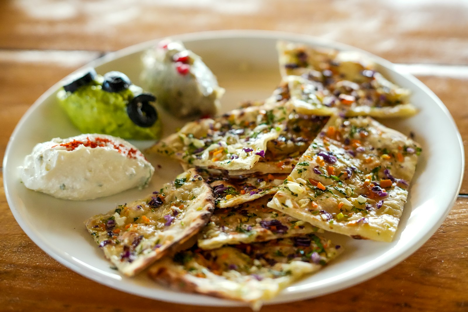 Zaatar flatbread with labneh and olives for mezze