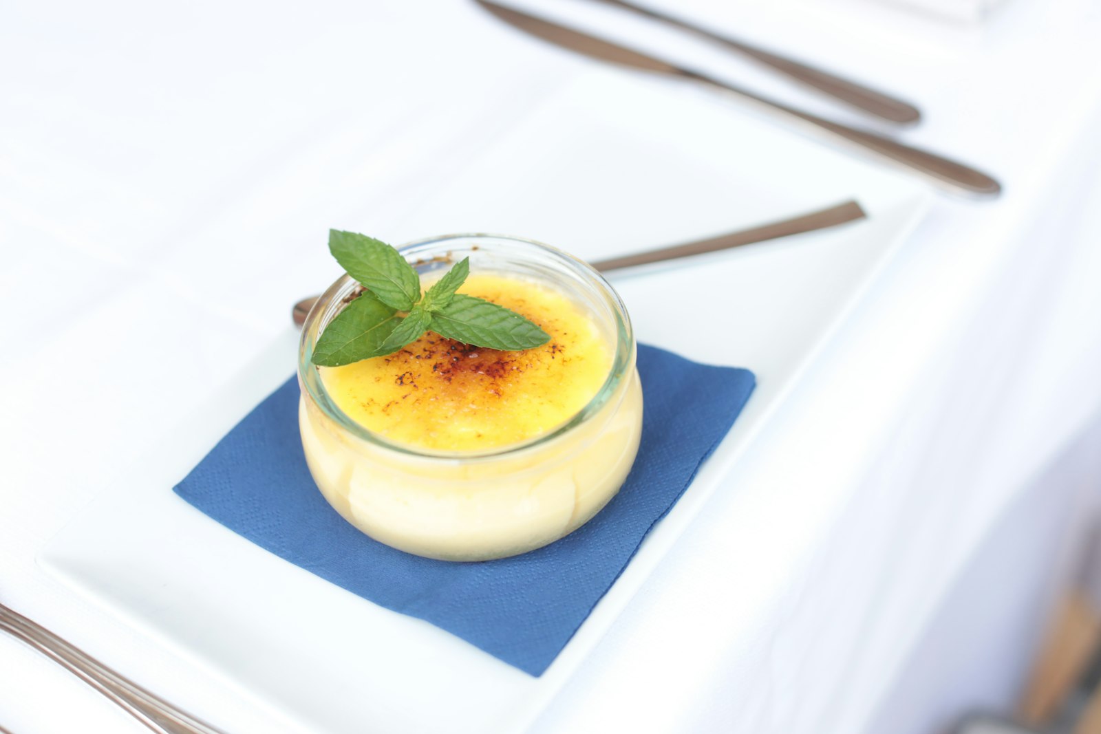 Vanilla custard in a glass with mint
