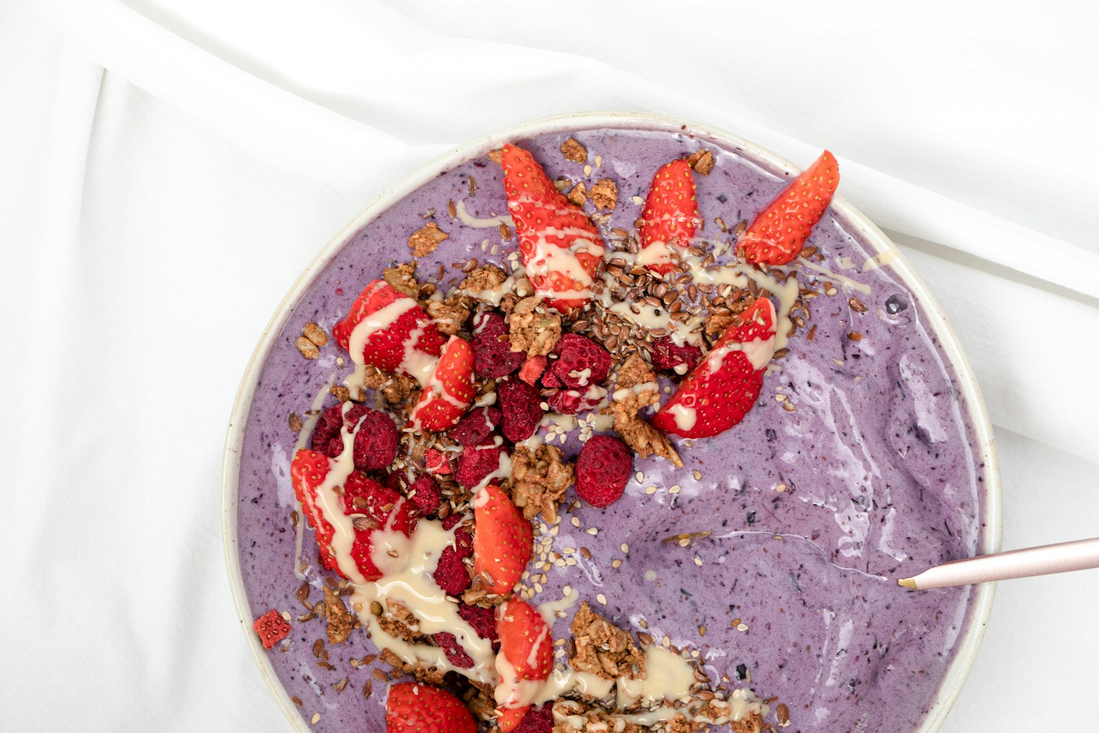 Berry nice cream bowl with sliced strawberries