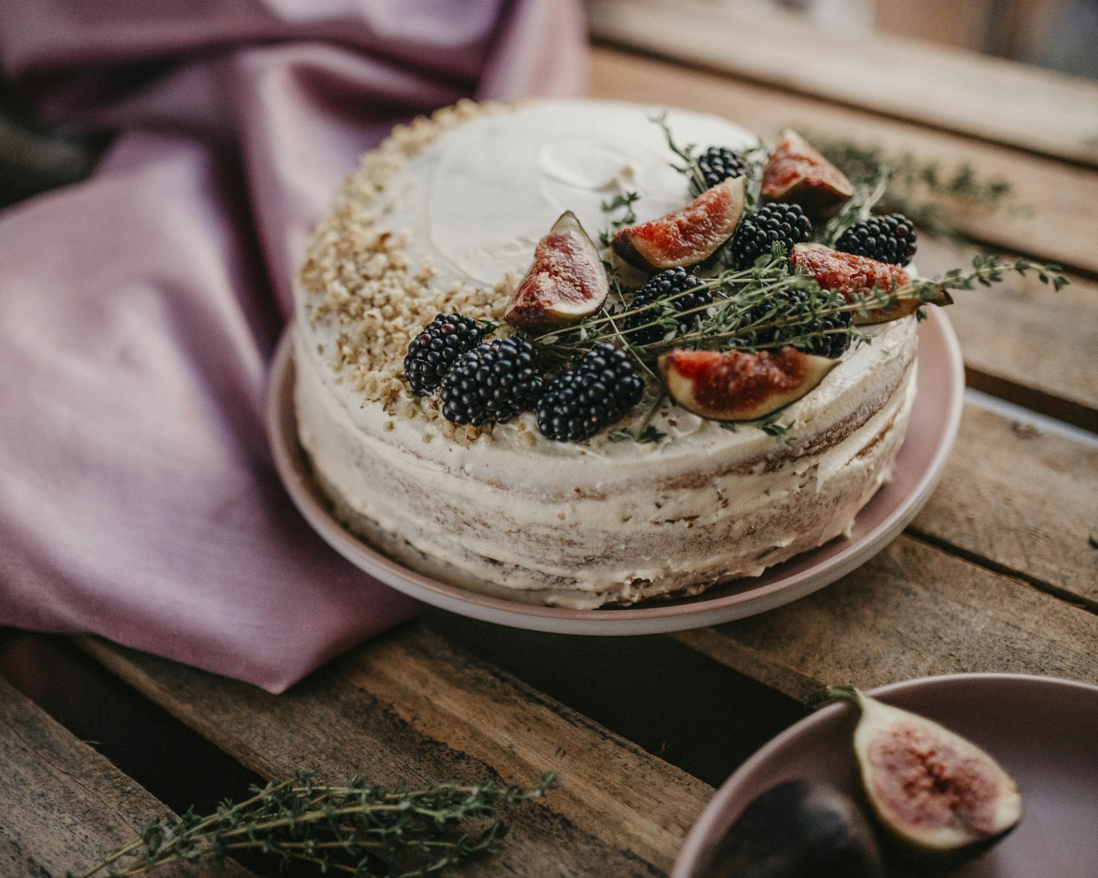 Naked cake decorated with blackberries and figs