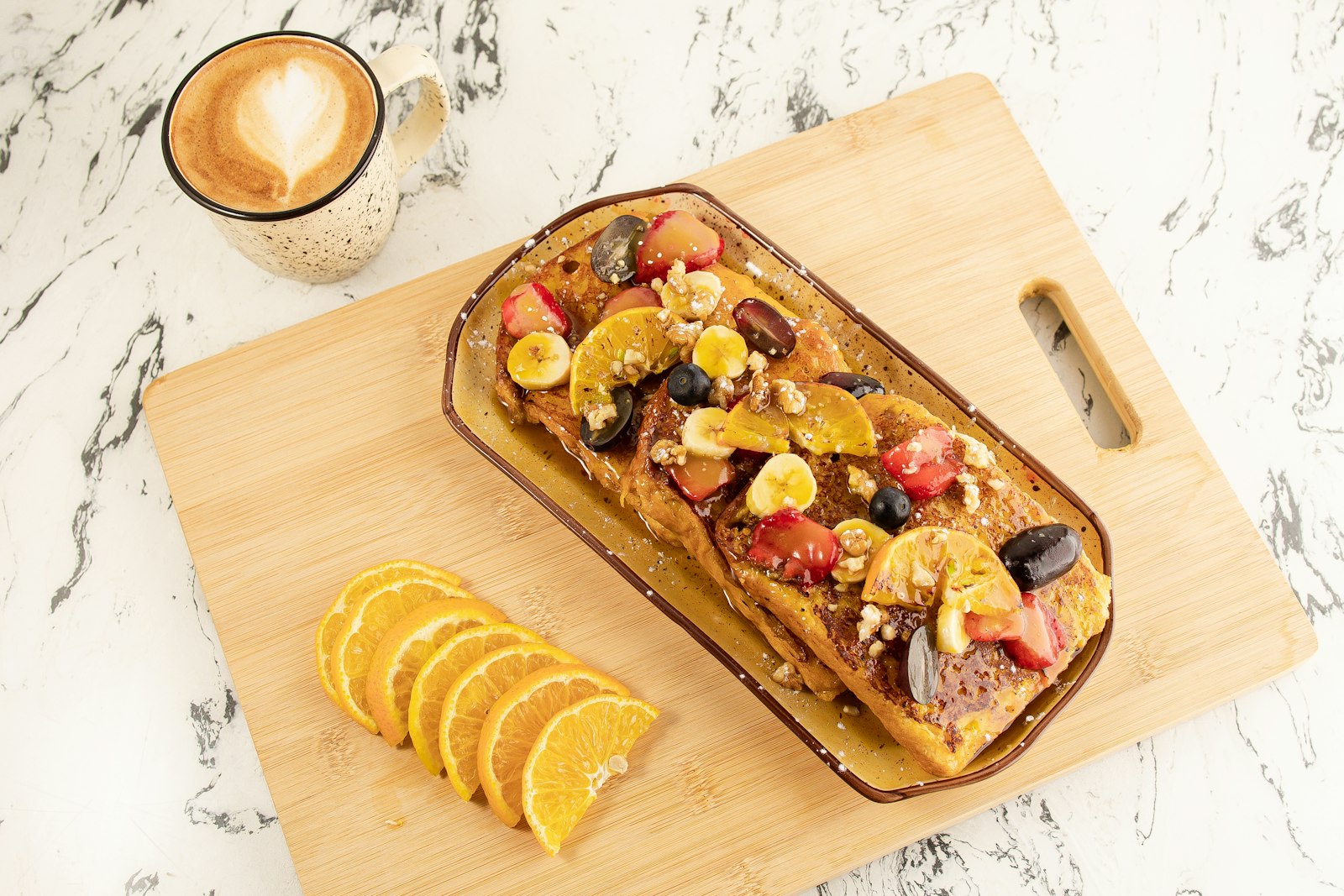 Fruit topped loaf bake on a board