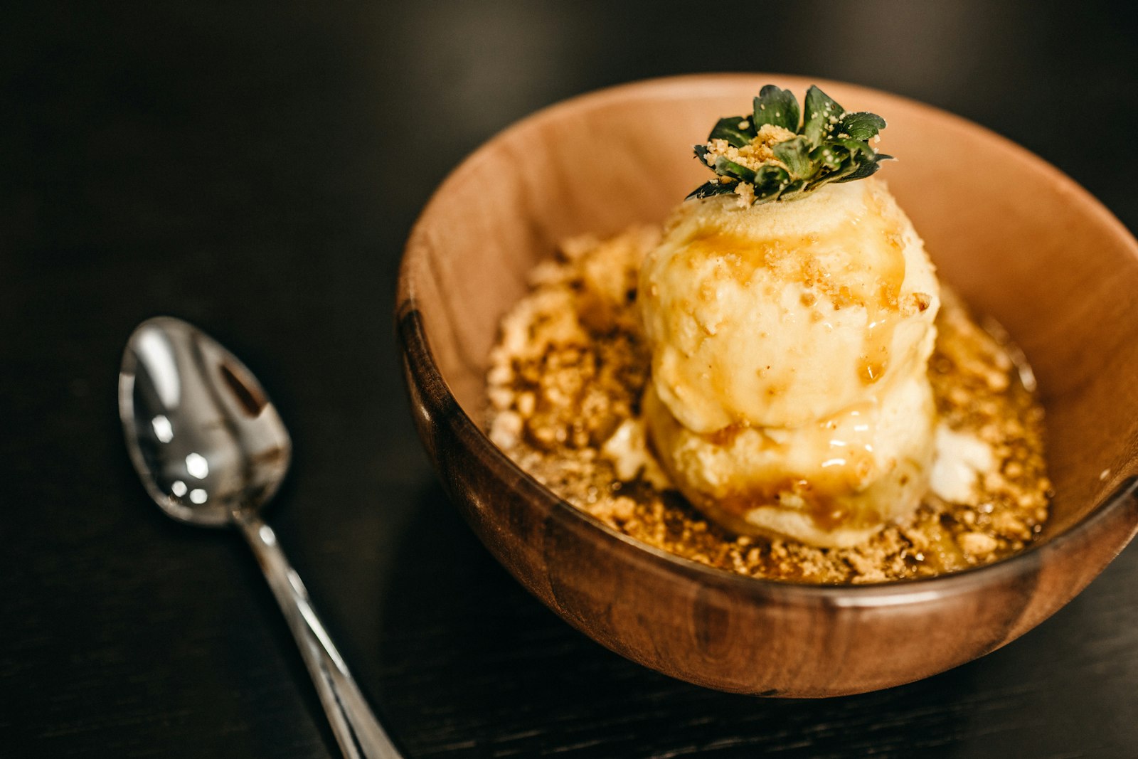 Warm fruit crisp topped with vanilla ice cream