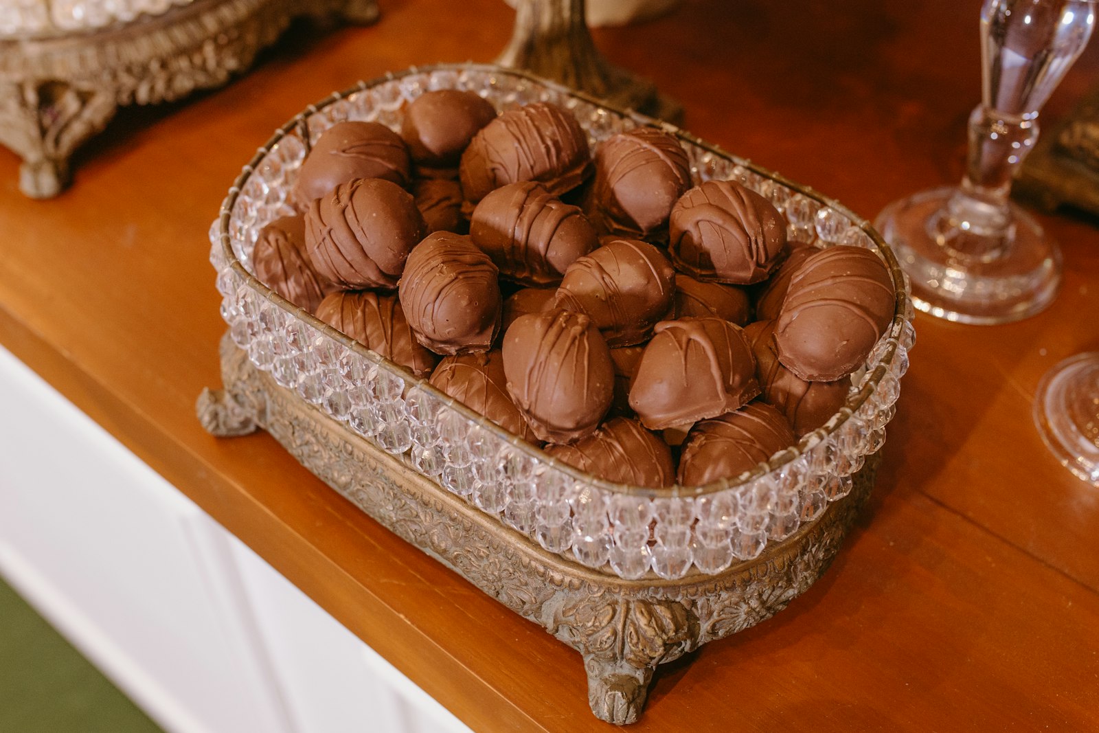 Chocolate dipped cherries in a crystal dish