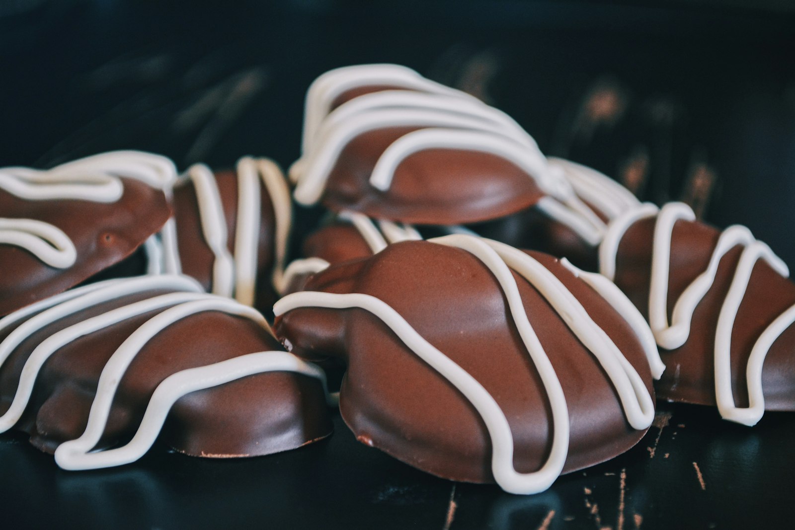 Chocolate covered stuffed dates with white drizzle