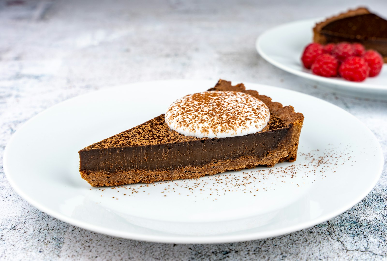 Chocolate chess pie slice with cream