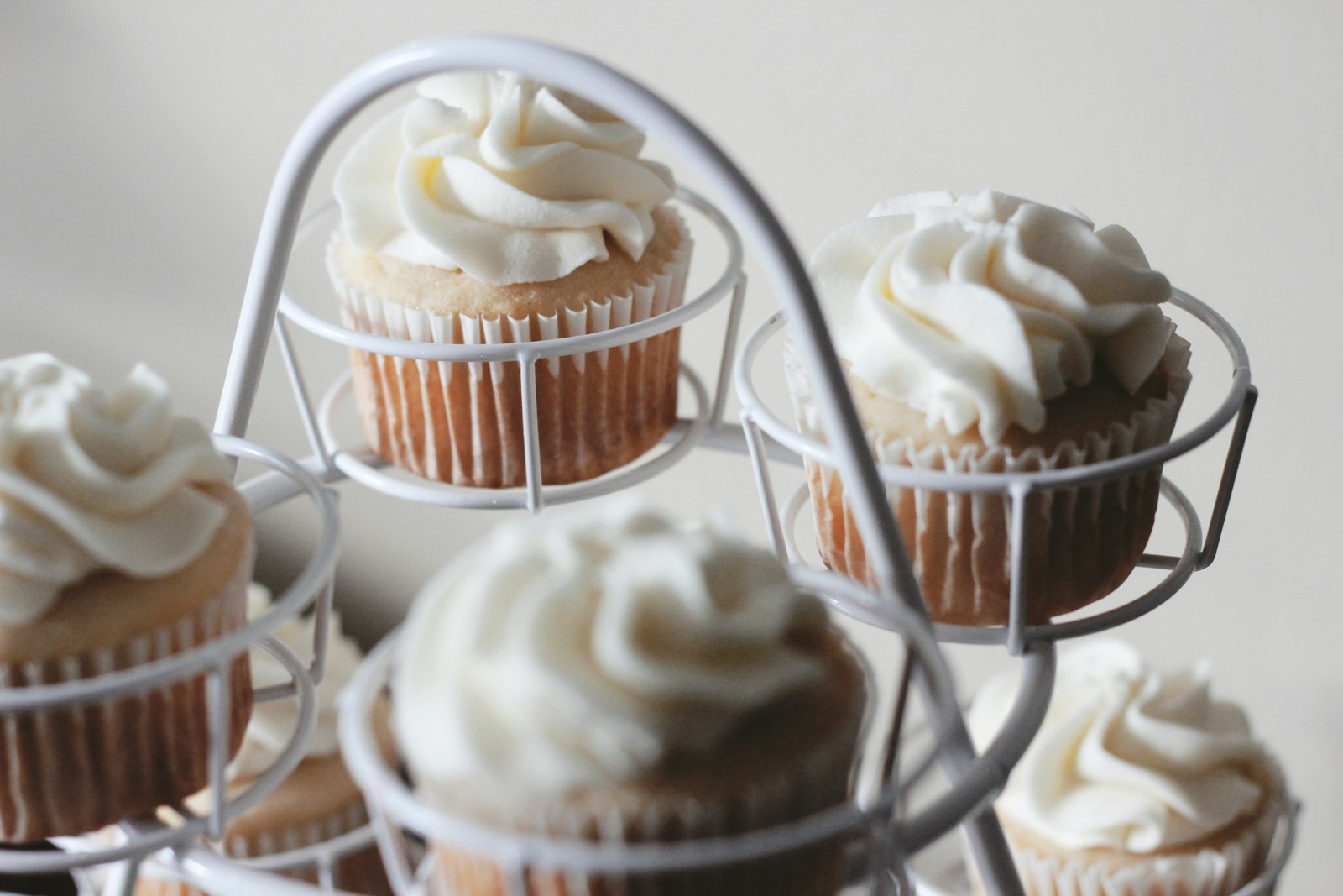 Coconut cupcake on a wire stand
