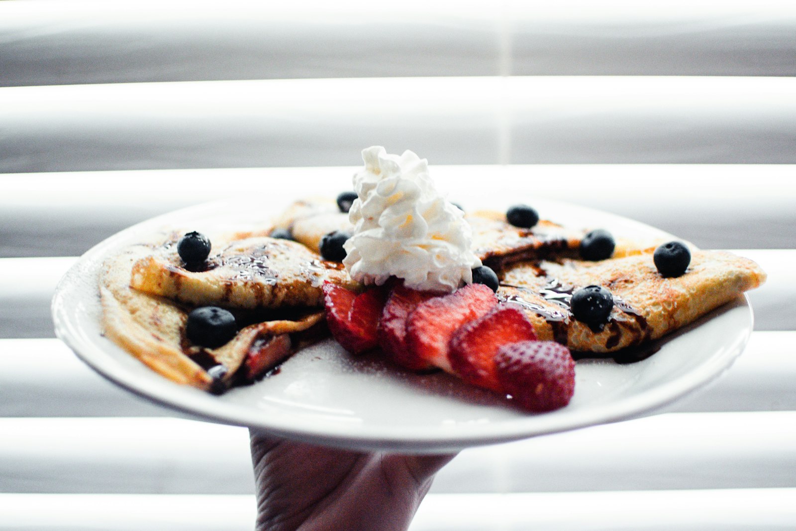 Berry crepes with whipped cream