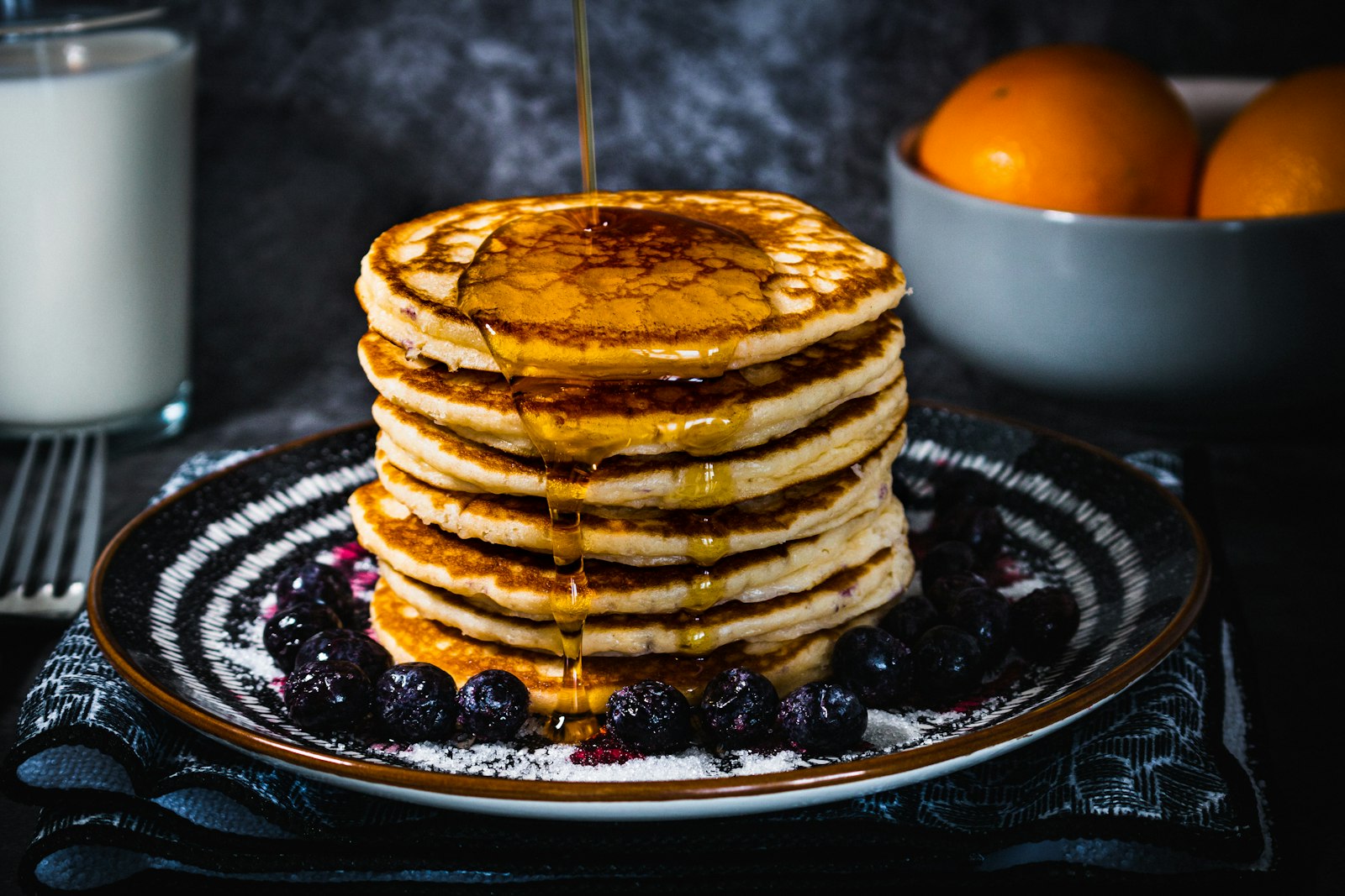 Gingerbread pancakes stacked with syrup