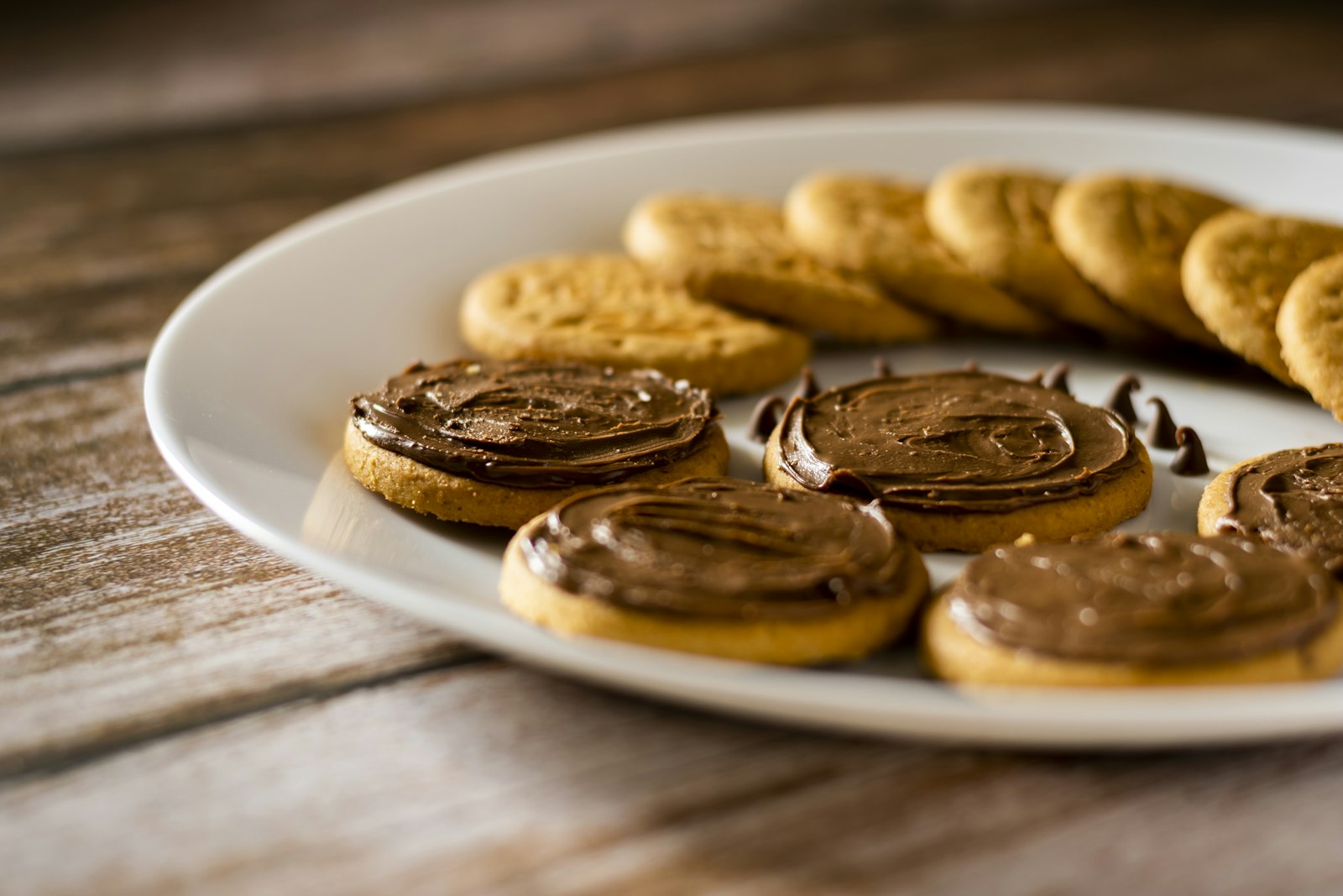 Biscuits topped with chocolate hazelnut spread
