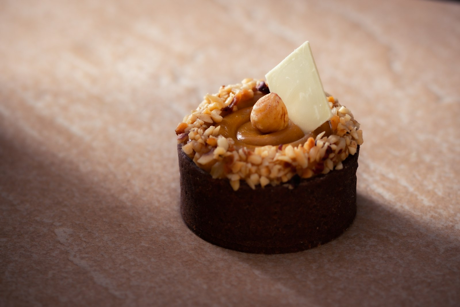 Chocolate mousse cup topped with hazelnut praline