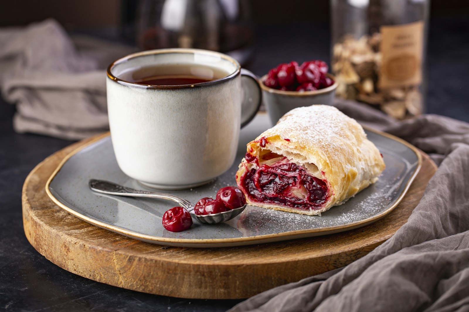 Cherry turnover pastry with a cup of tea