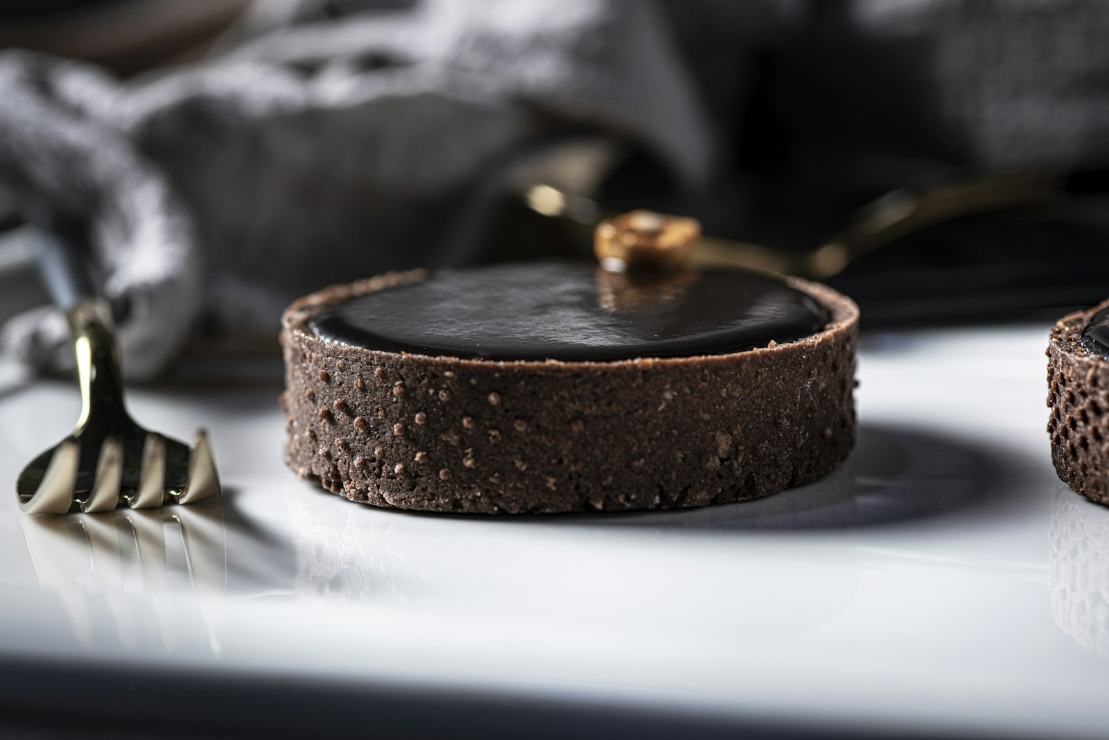 Mini chocolate tartlet with a fork