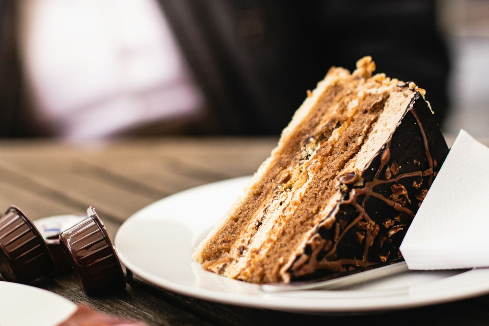 Slice of Italian cream cake with white frosting