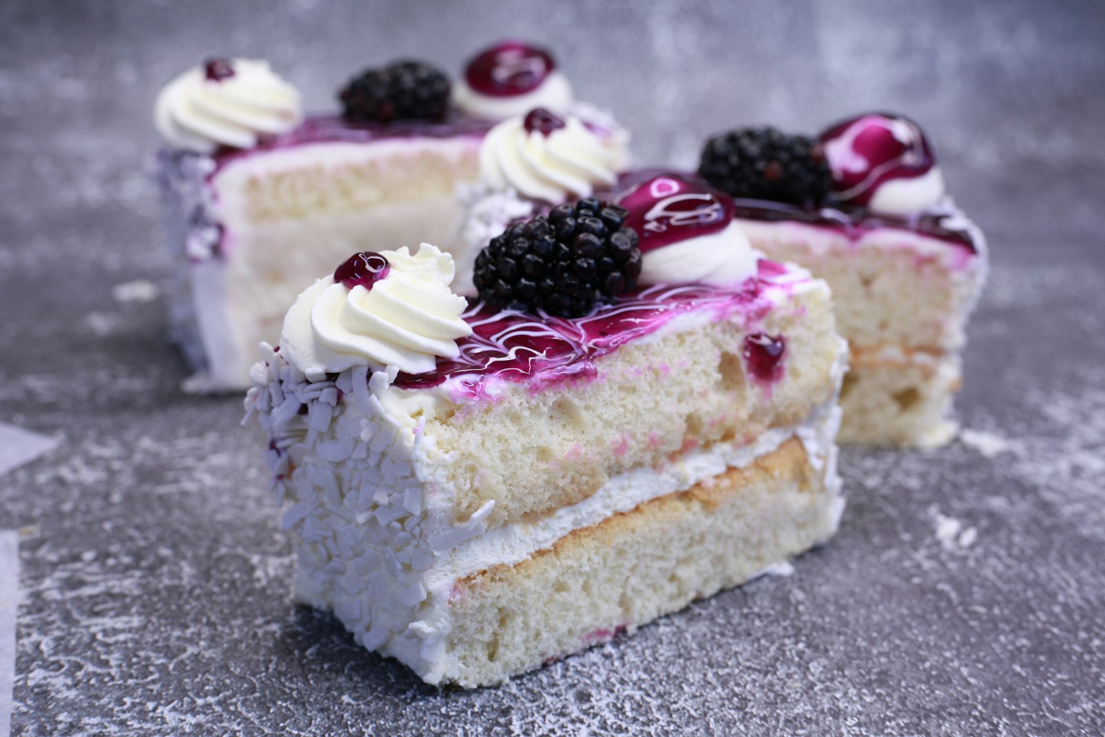Blackberry jam cake slices with fresh blackberries