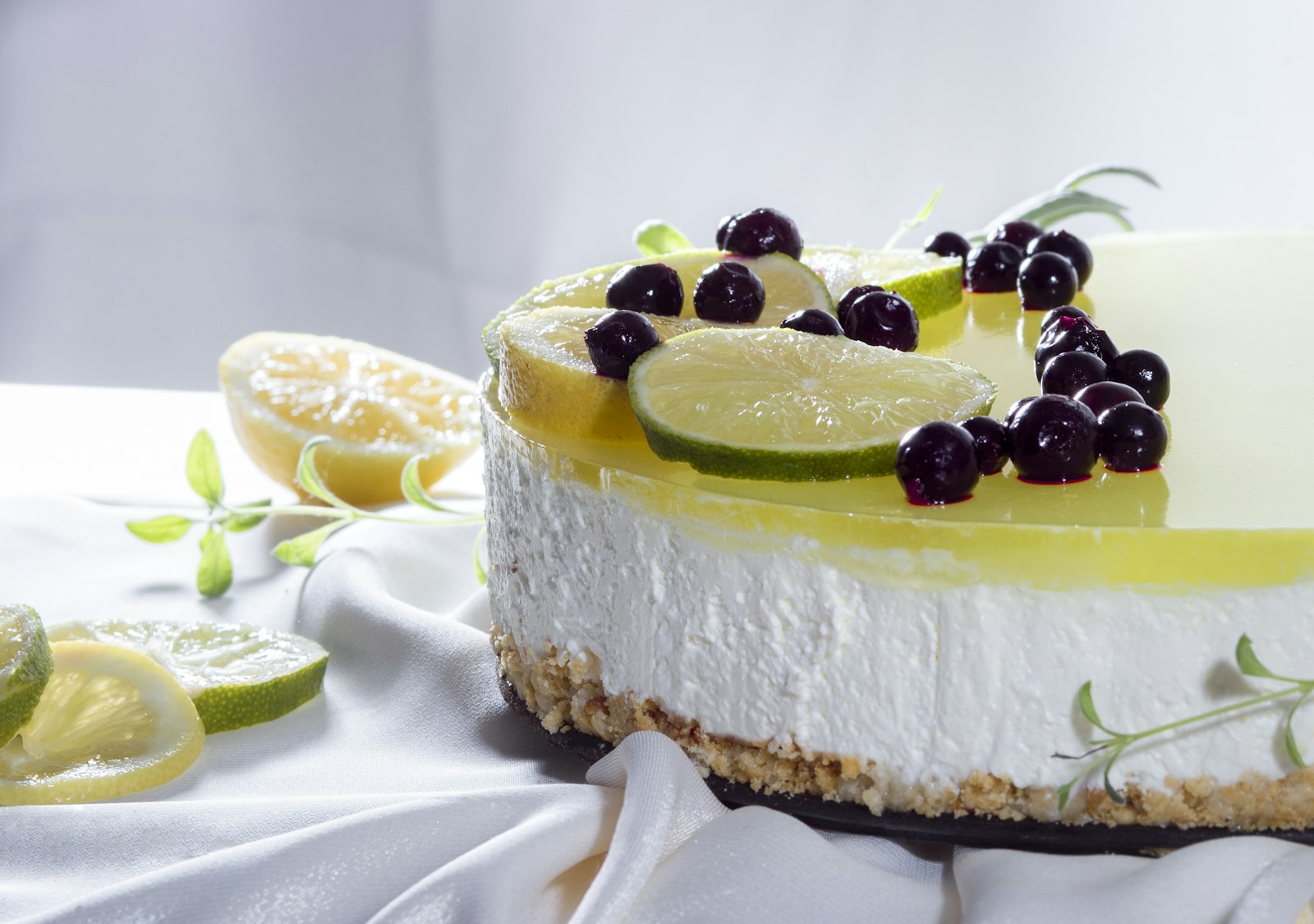 Lemon cheesecake topped with blueberries and lime
