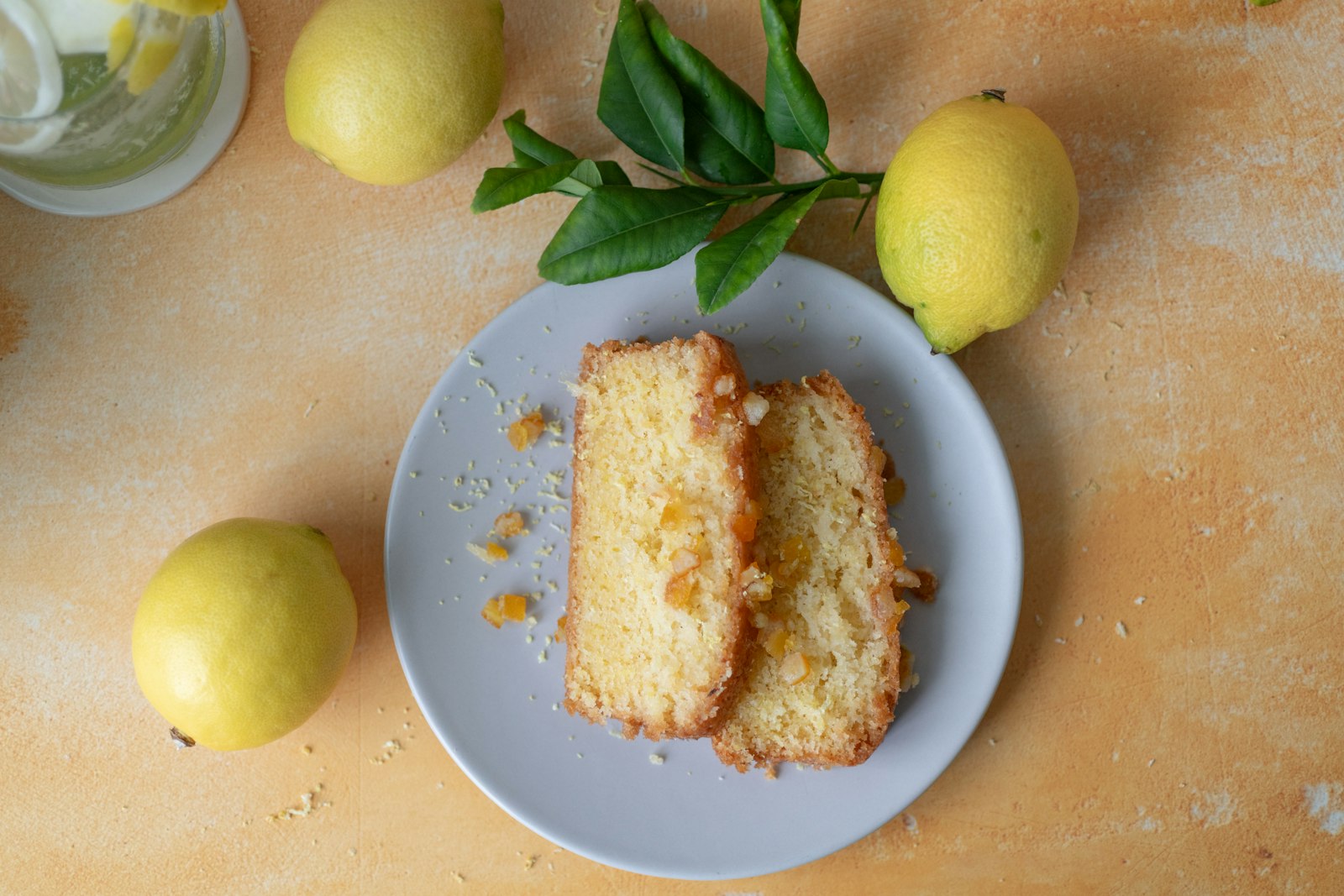 Lemon cake slice with fresh lemons