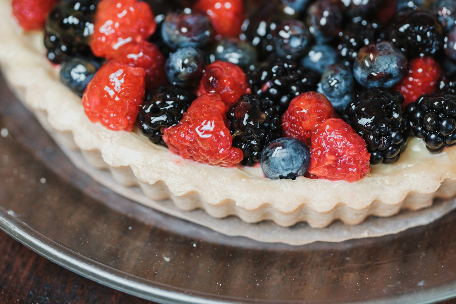 Mixed berry tart with strawberries, blueberries and blackberries