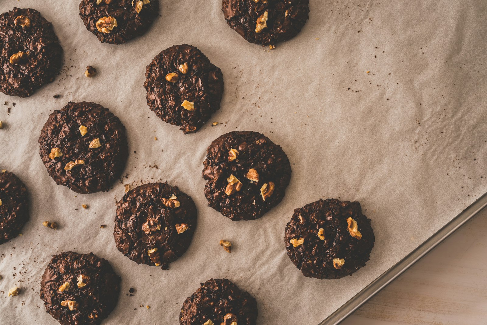 Chocolate oat cookies setting on parchment