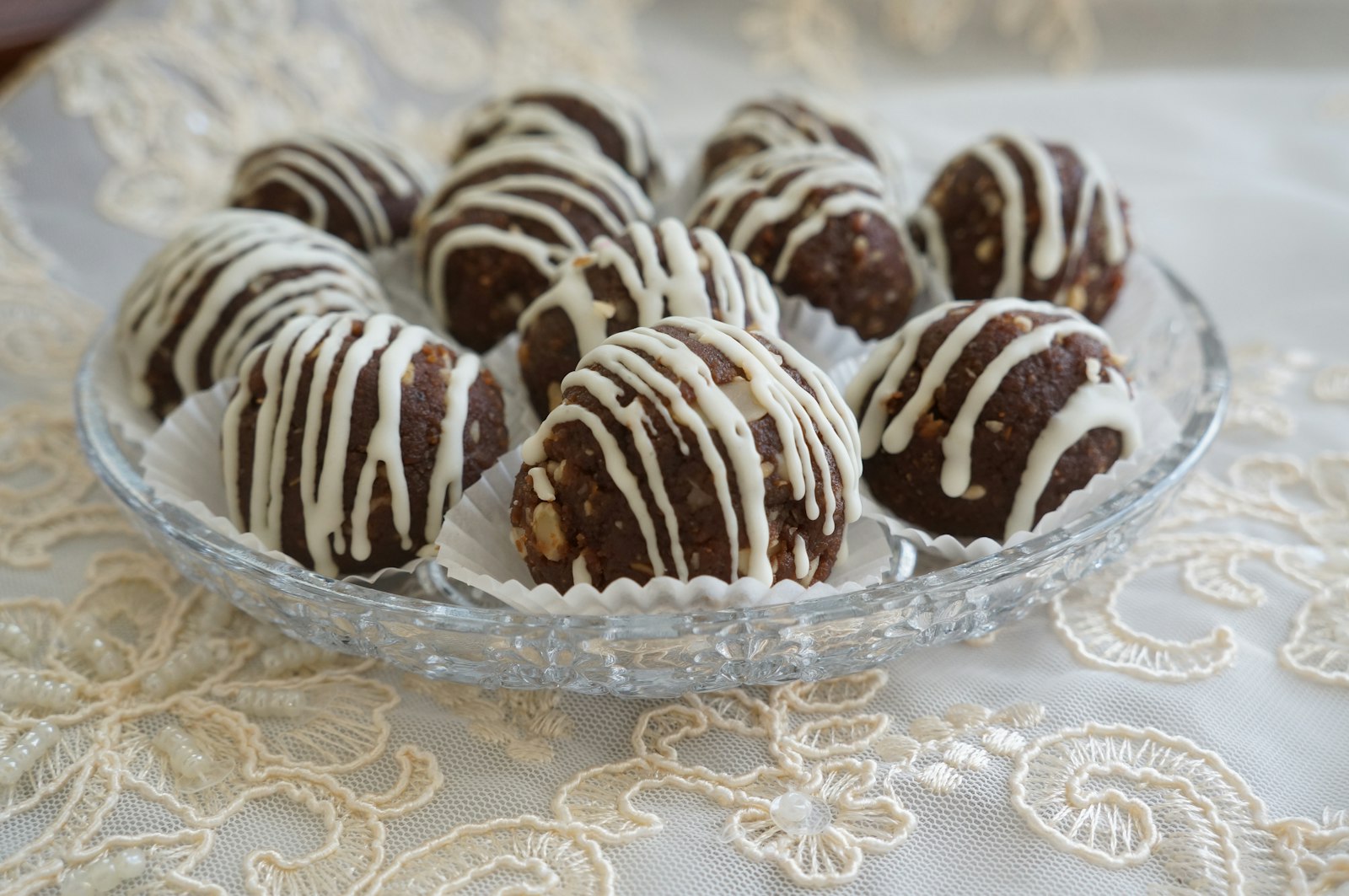 Cookies and cream truffle balls with white chocolate drizzle