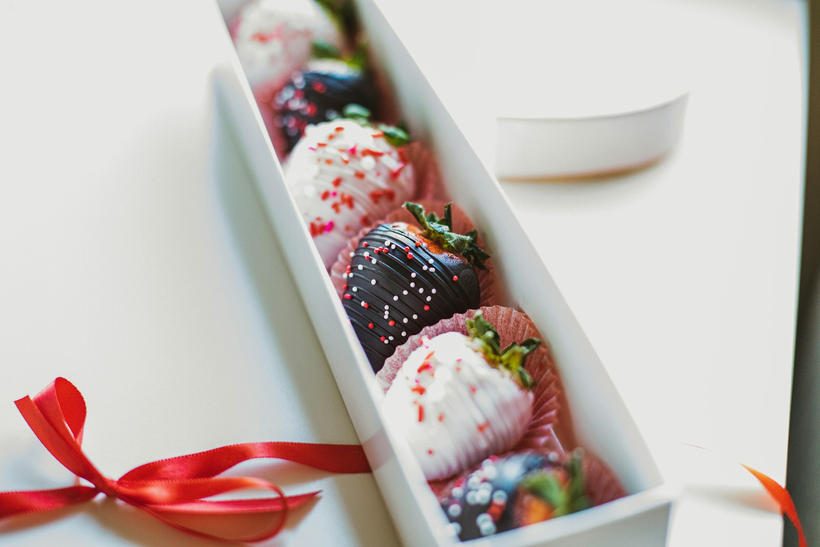 Chocolate dipped strawberries in a white dish