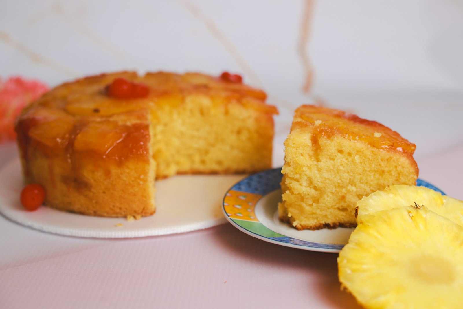 Pineapple upside down cake with a cut wedge