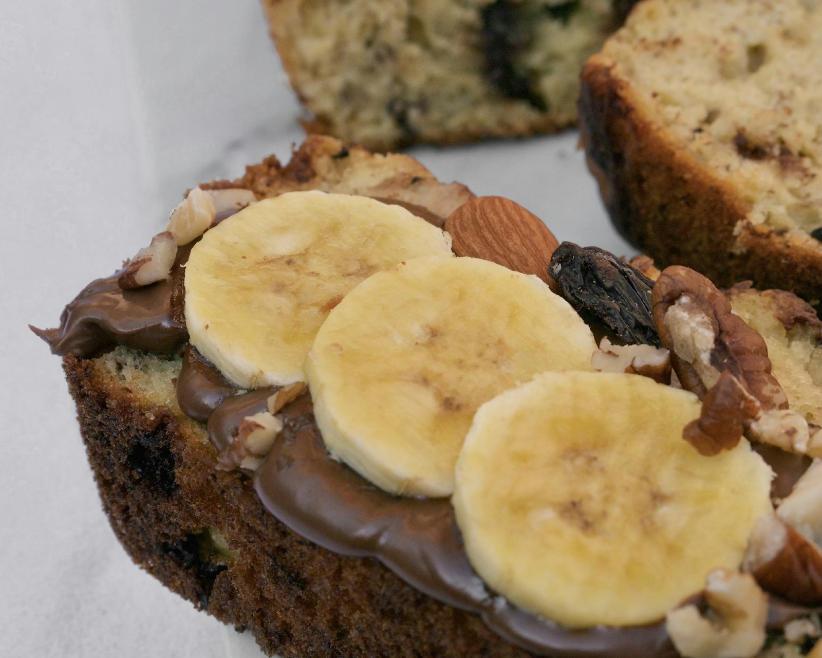Chocolate snack cake topped with banana slices