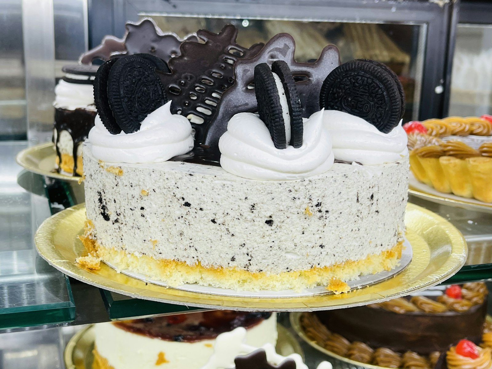 Cookies and cream poke cake topped with chocolate cookies