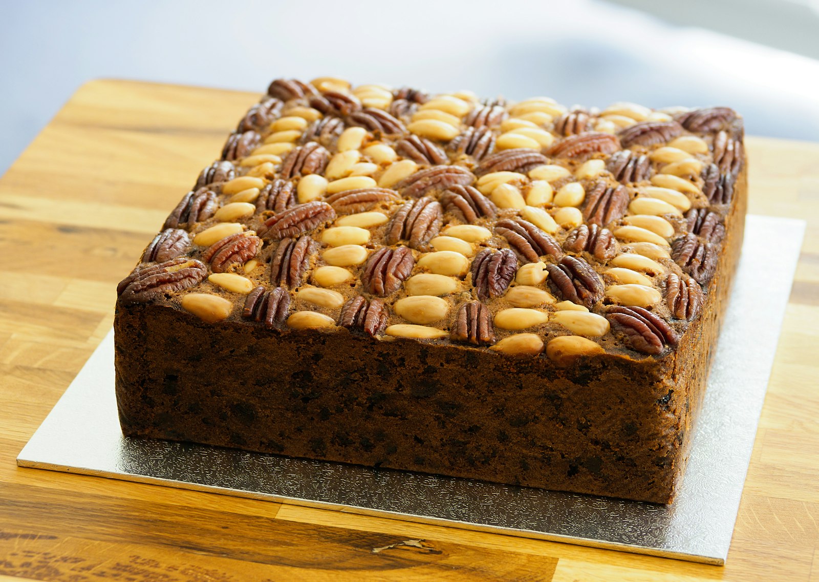 Chocolate peanut bars topped with nuts