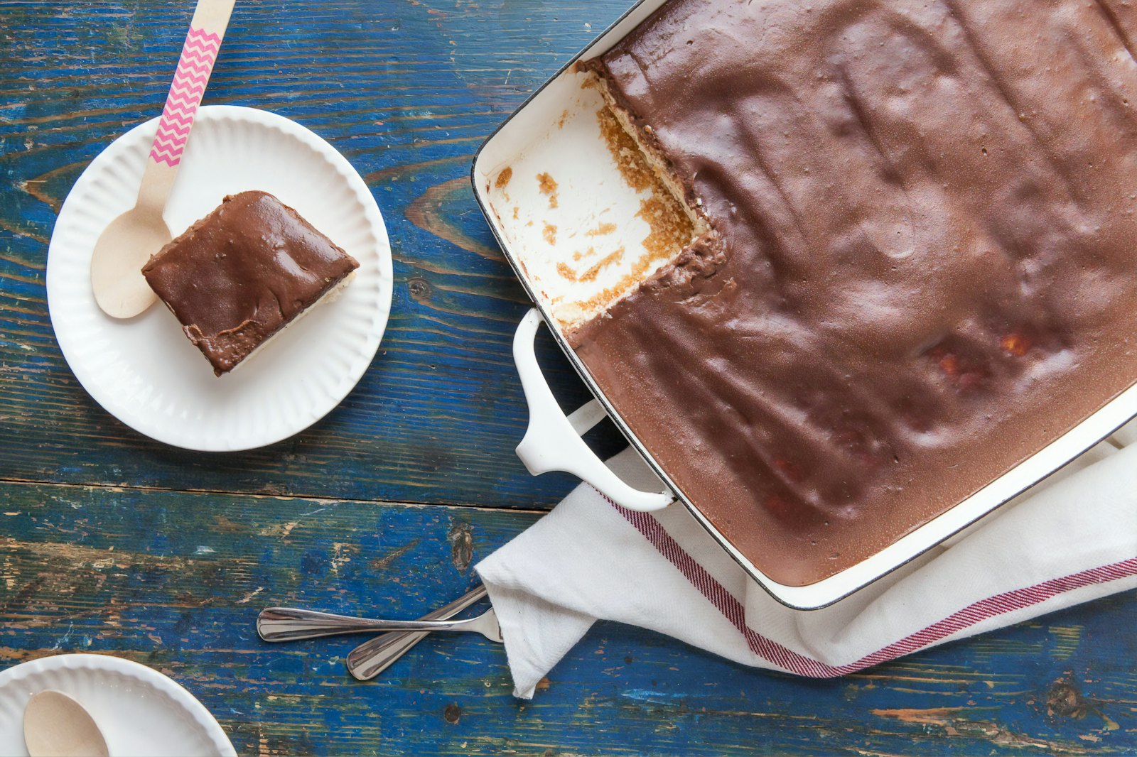 Chocolate pudding poke cake with a slice cut out