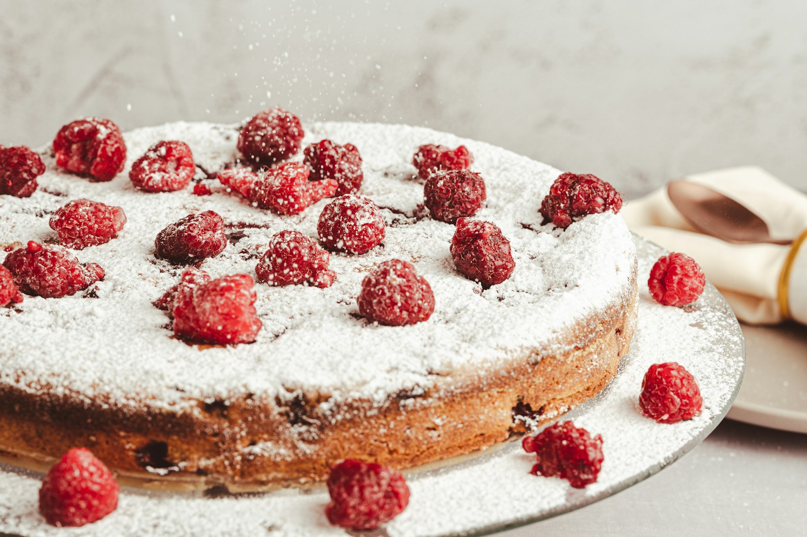 Raspberry topped bake with powdered sugar